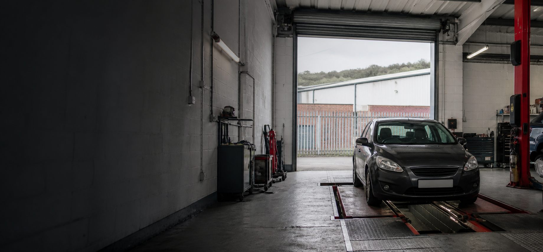 Vehicle in an independent garage inspection bay